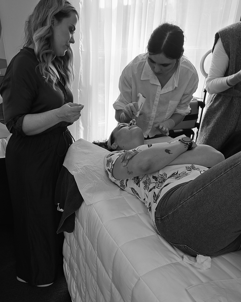 Lady lying on bed receiving a Dermapen4 treatment