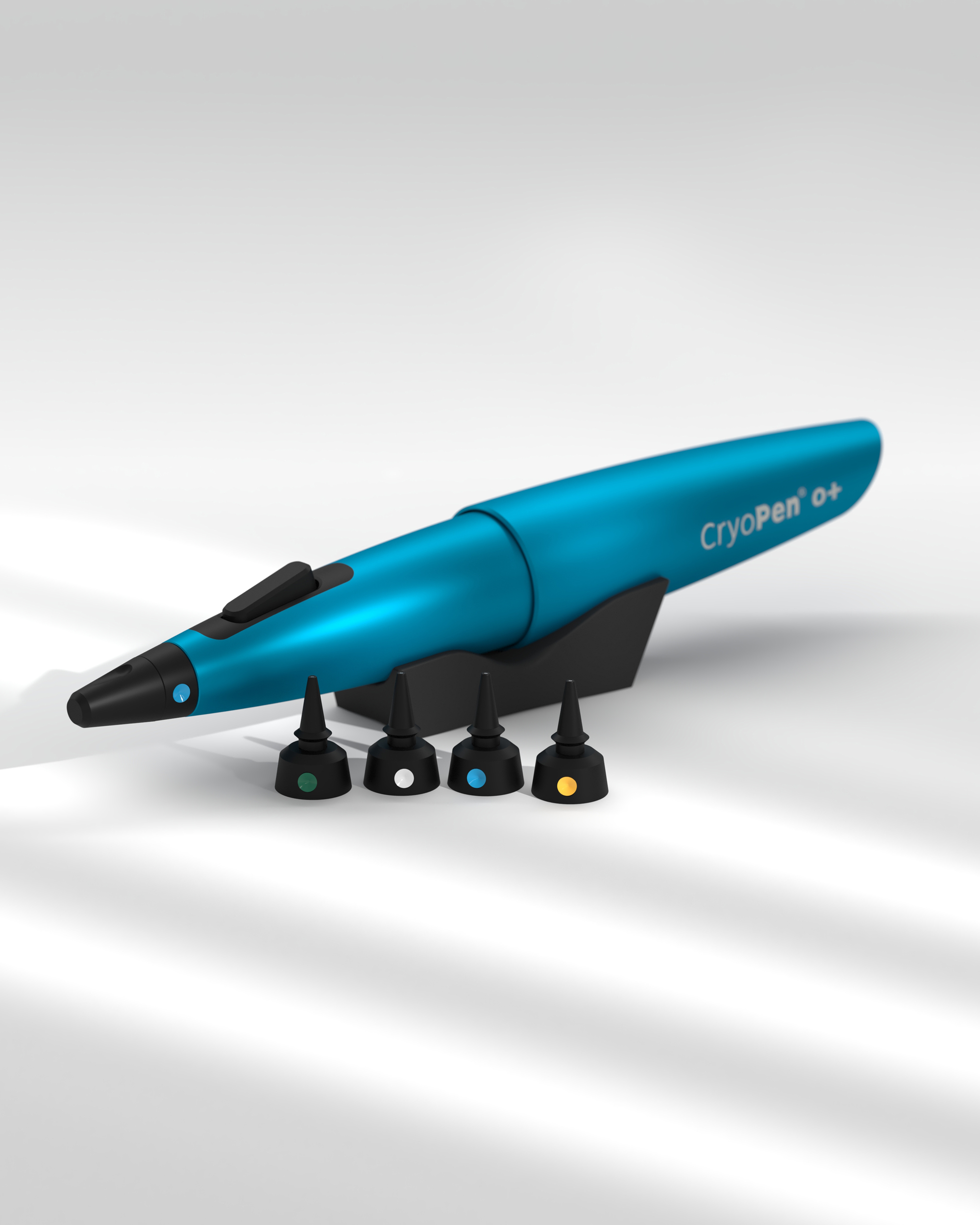 CryoPen device with different attachements on grey desk