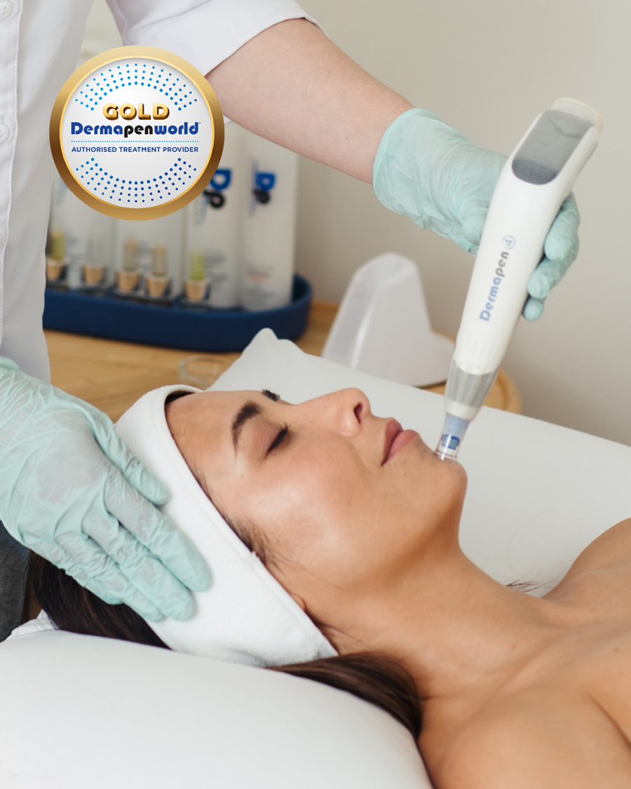 Lady lying on treatment bed in clinic receiving a Dermapen 4 treatment on chin