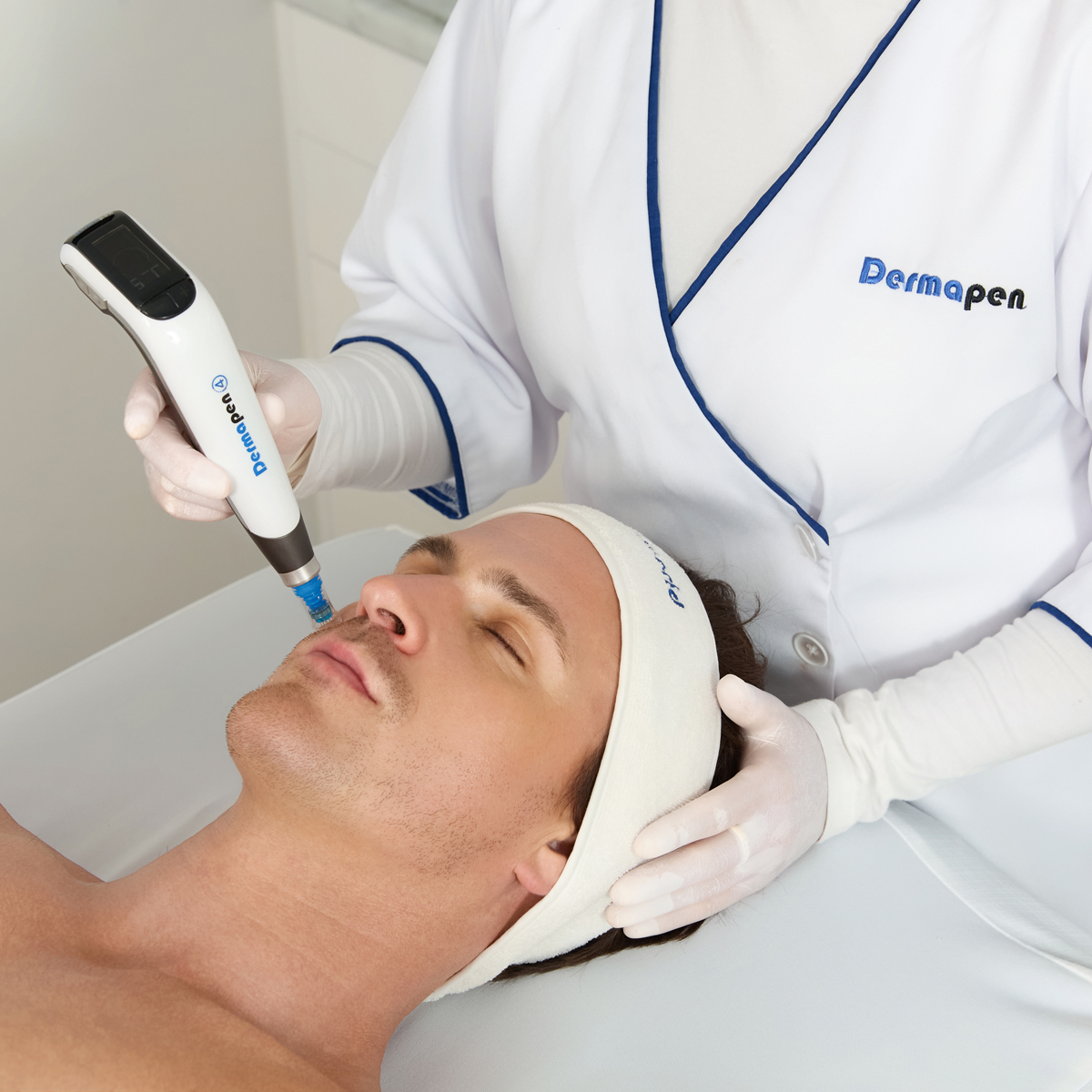 Male client receiving a Dermapen treatment on face