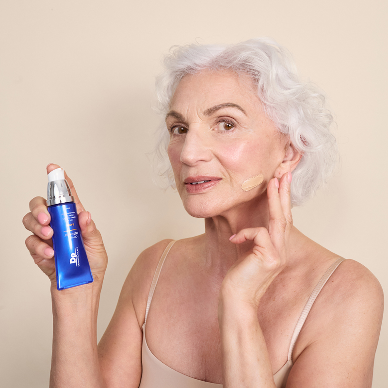 Lady applying Dp Dermaceuticals Cover Recover on face