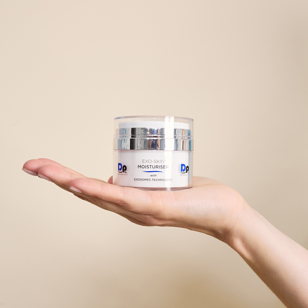 Person holding Dp Dermaceuticals Exo-Skin Moisturiser in hand