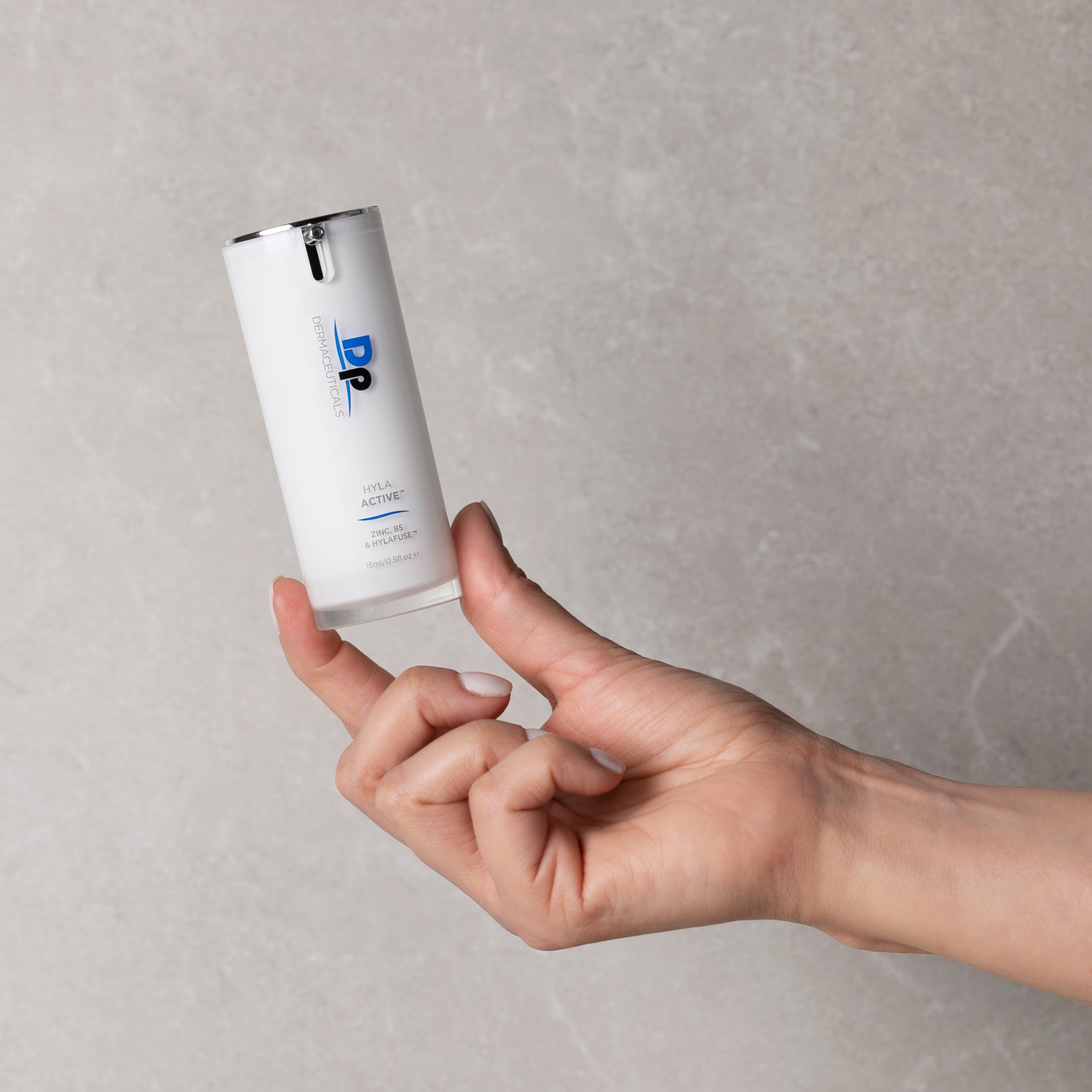 Person holding Dp Dermaceuticals Hyla Active