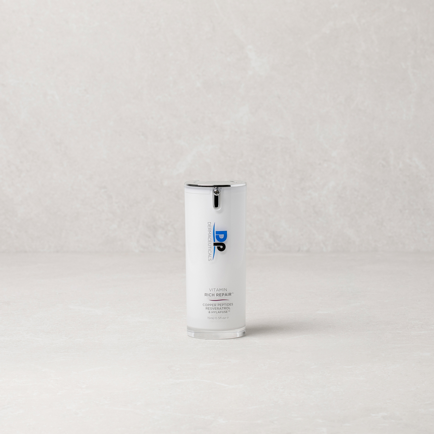 Dp Dermaceuticals Vitamin Rich Repair product in front of grey background