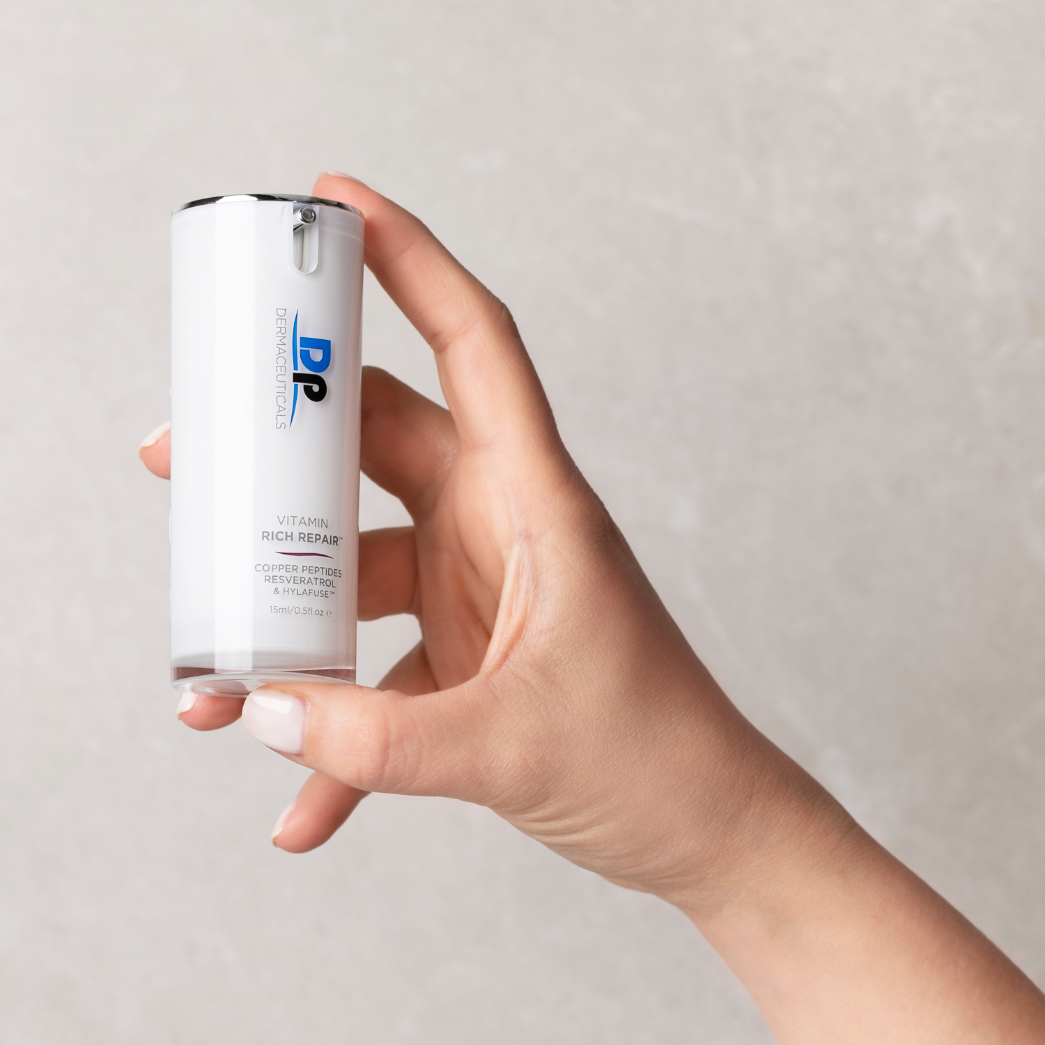 Dp Dermaceuticals Vitamin Rich Repair in persons hand