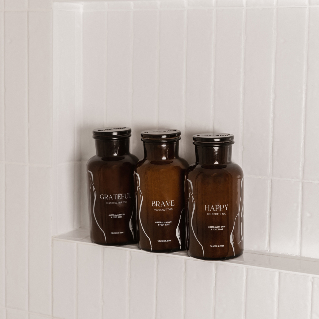 Bath and foot soak in white tile shower nook