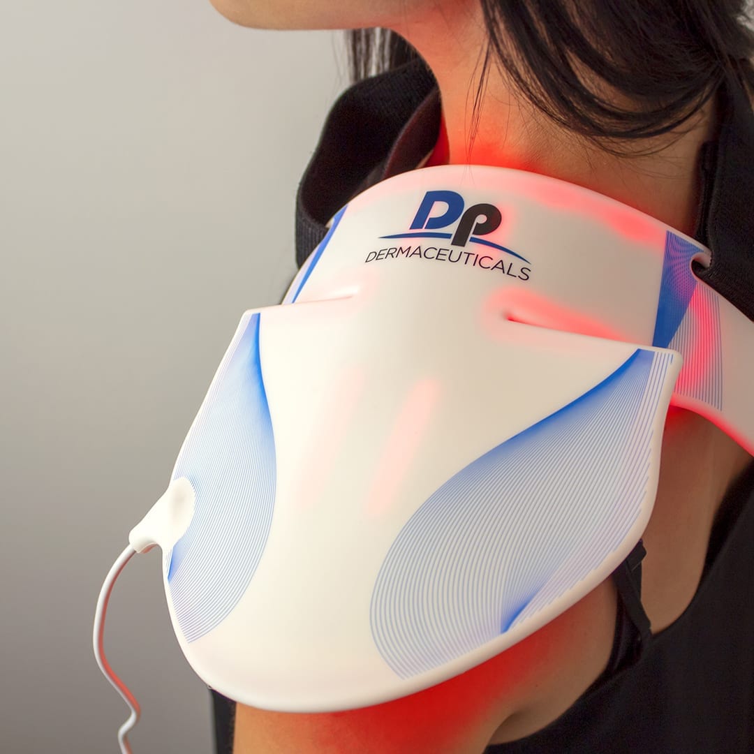 brunette woman led mask shoulder