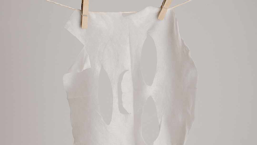 NEUROCOSEMDICS by GINGER&ME B3 Glow Sheet Mask hanging on line