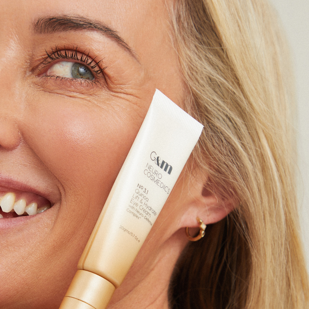 Lady holding NEURO Quinoa Lift & Hydrate Eye Cream by face
