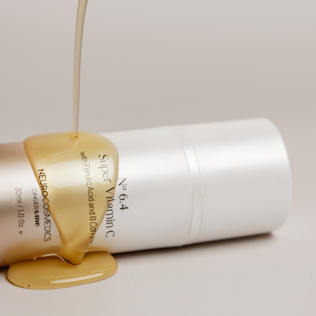 NEURO Super Vitamin C serum lying on side with serum dripping onto it