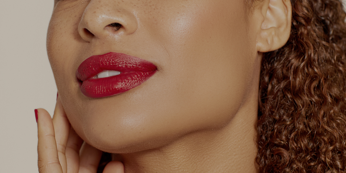 Close up of ladys face, wearing red lipstick
