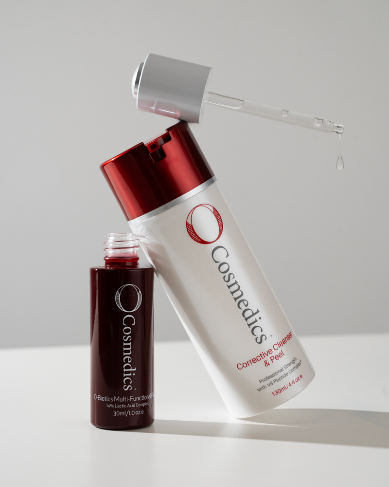 Range of O COSMEDICS skincare leaning against each other