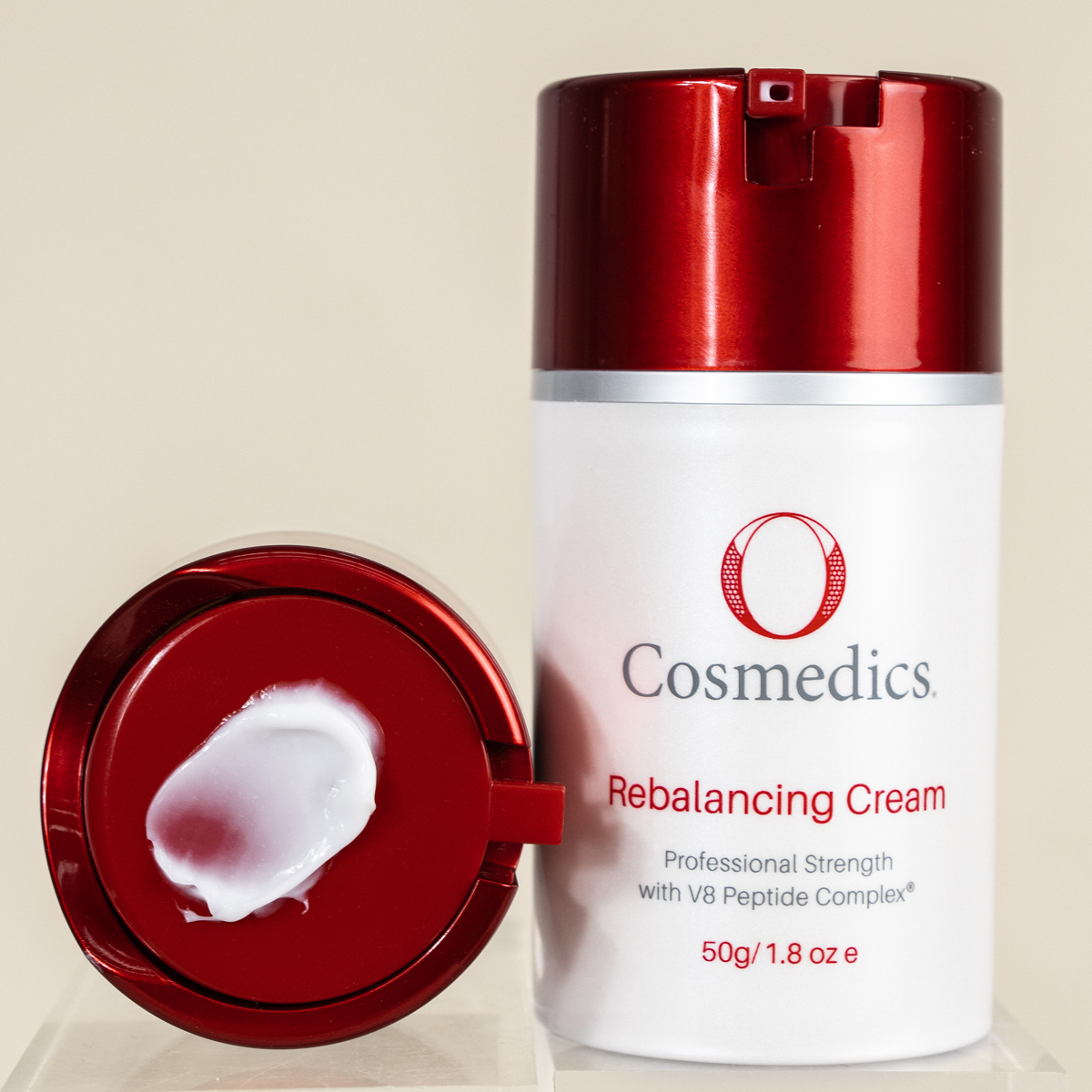 O COSMEDICS Rebalancing Cream product with cream on lid