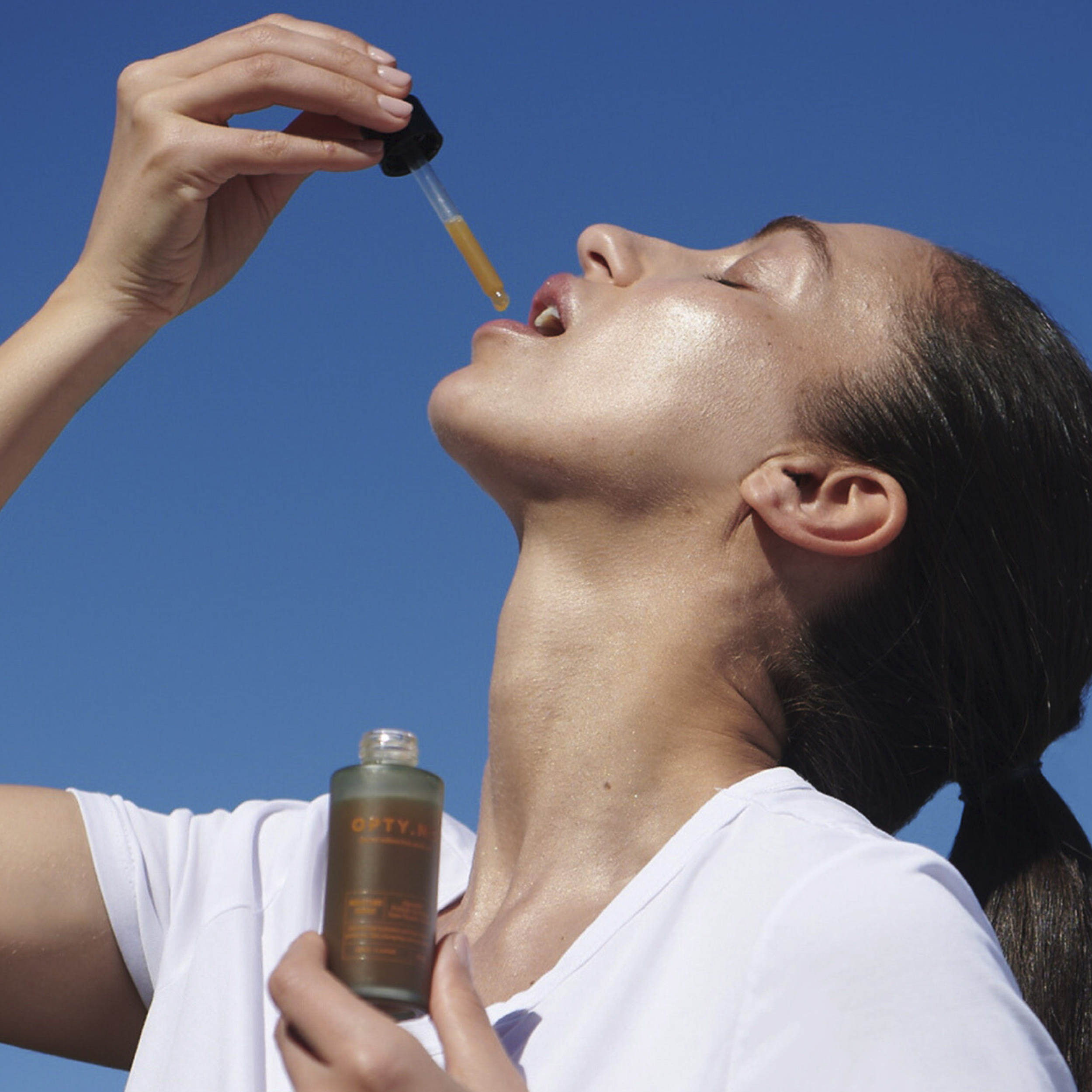 woman ingesting opty.nc product