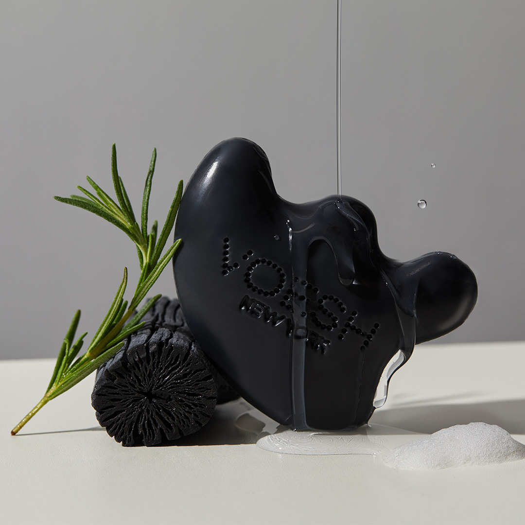 VOESH Gau Sha Cleansing Bar with water being poured on it