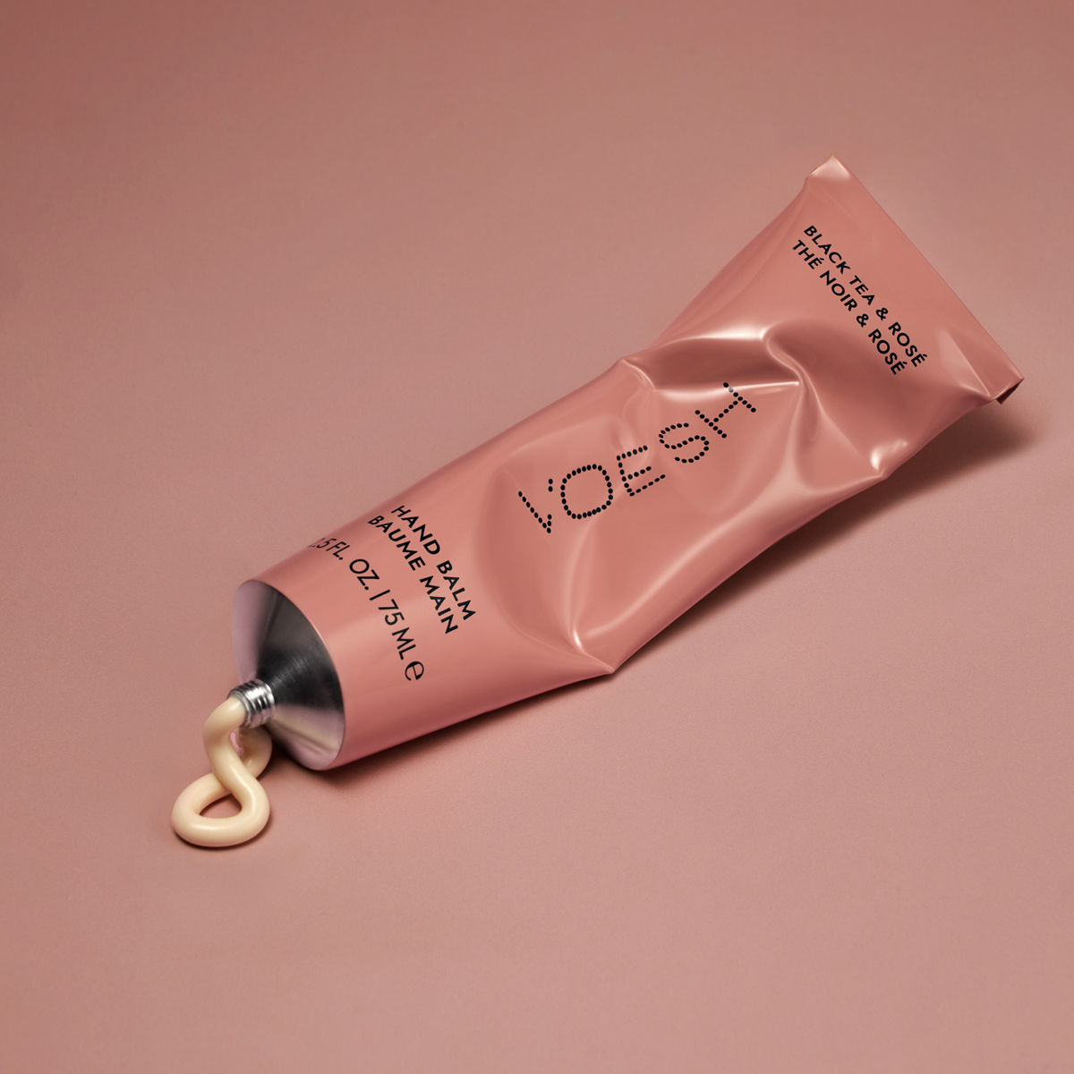 Hand balm being squeezed out of VOESH Hand Balm Black Tea & Rosé tube