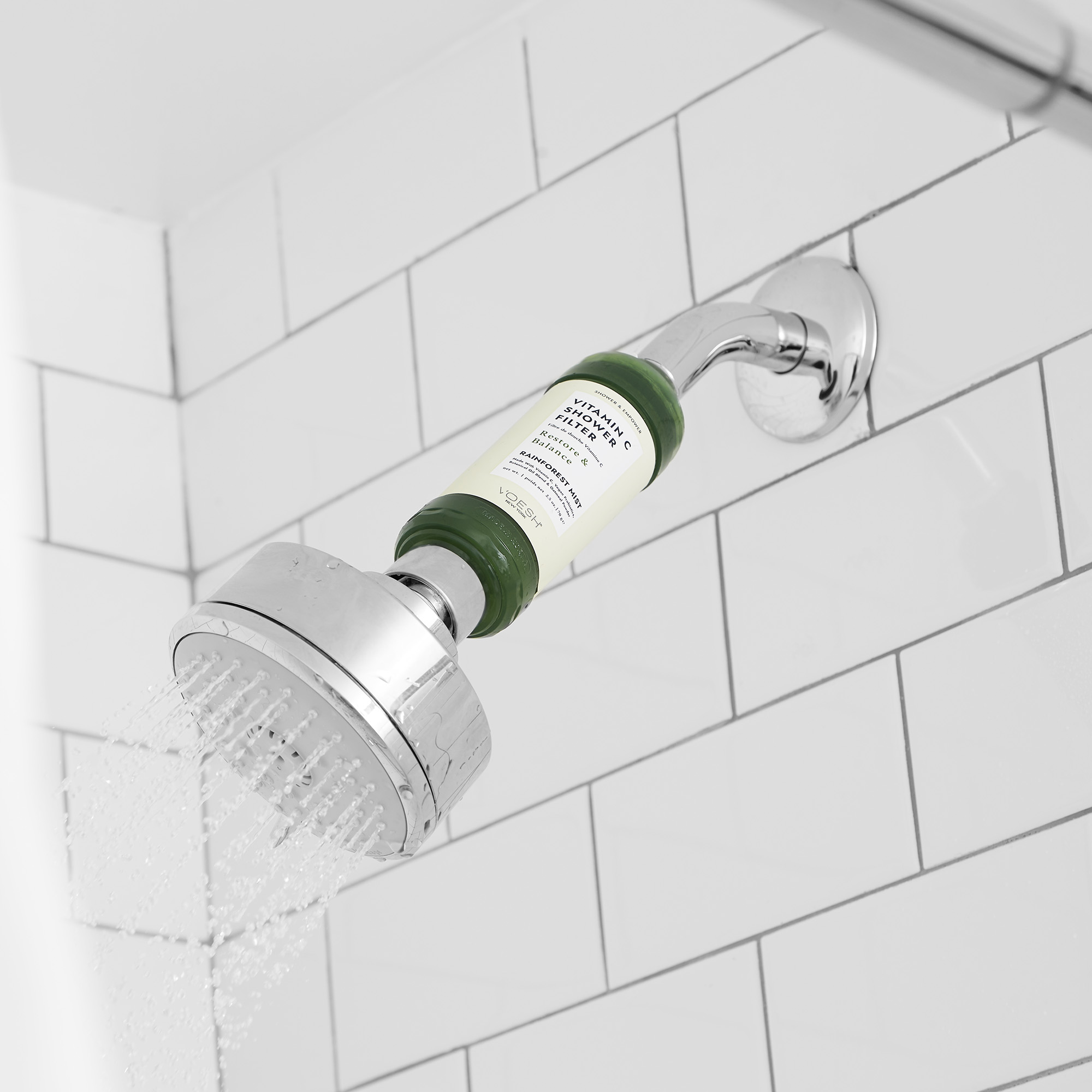 VOESH Vitamin C Shower Filter Rainforest Mist attached to shower head in shower