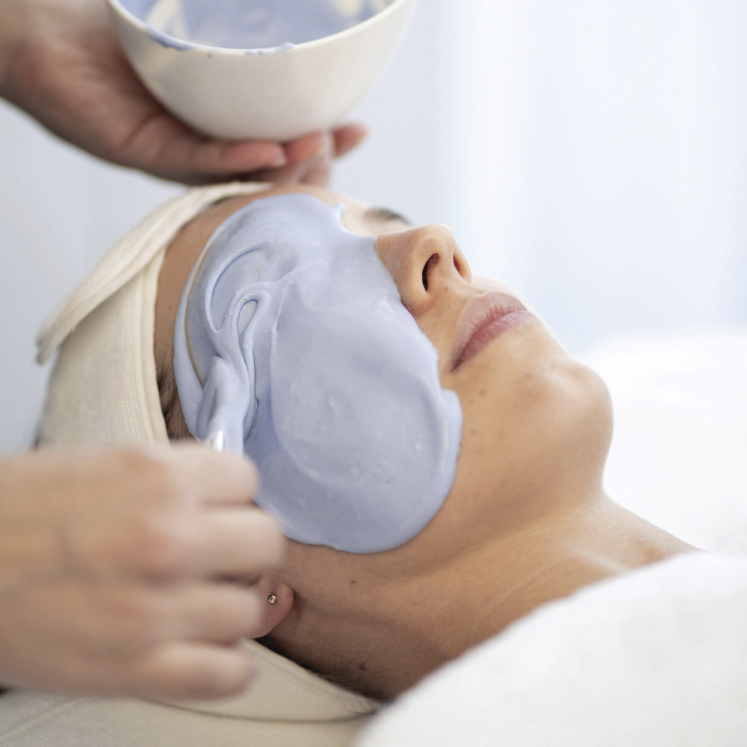 woman receiving the o cosmedics pro dermal planning peel treatment