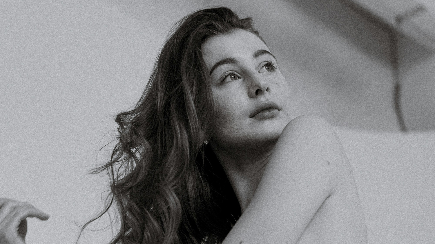 Young lady with hair out in black and white